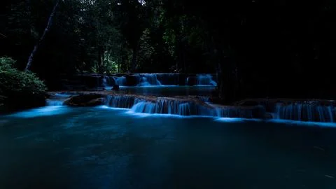 Cascading Waterfall Flows Through Lush Tropical Forest At Huai Mae Khamin W.. Fotos Stock