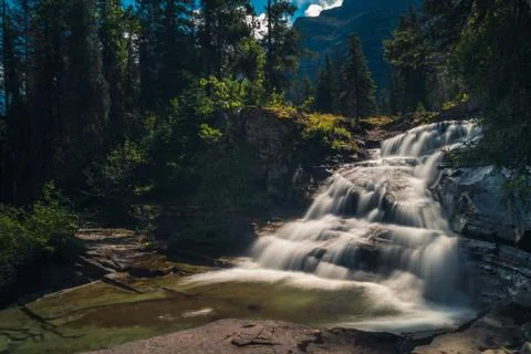 Cascading waterfall in the forest. Stock Photos