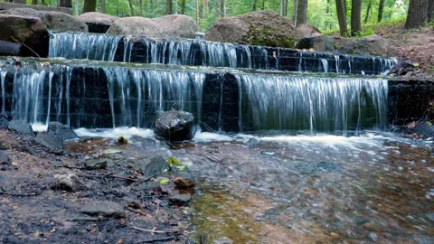 A cascading waterfall with large stones. Stock Footage 144673308