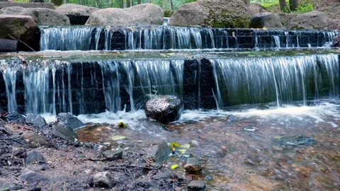 A cascading waterfall with large stones. Stock Footage 144674332
