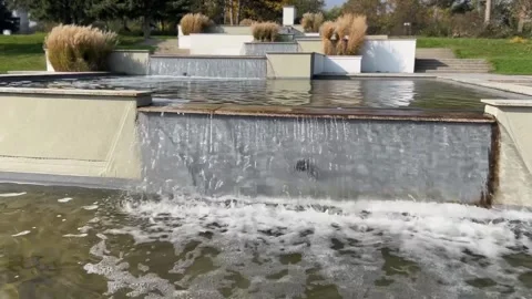 Cascading waterfall in a modern garden. Streams of water pour down. Stock Footage 293454130