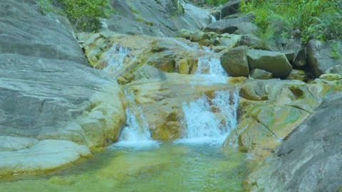 Cascading Waterfall Over Rocks | Peaceful Nature Sounds for Relaxation and Calm Stock Footage 286937082