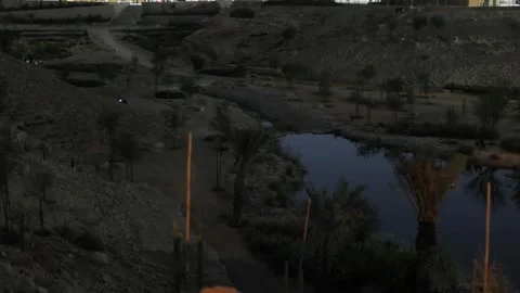 Cascading waterfall into pond Evening Видео 264976888