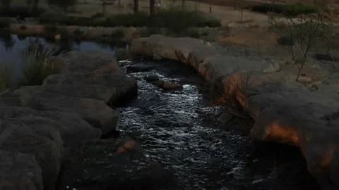 Cascading waterfall into pond Evening Video stock 268723326