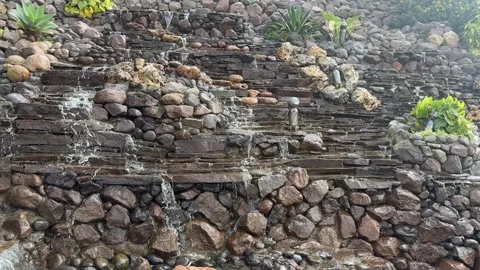 Cascading waterfall on stone and rocky walls Vídeo Stock 342686854