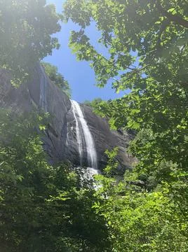 Cascading Waterfall in a window of trees 写真素材