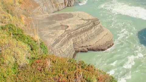 Cascading Waters Dance Through the Sculpted Cliffs of Los Alerces Stock Footage 327014903