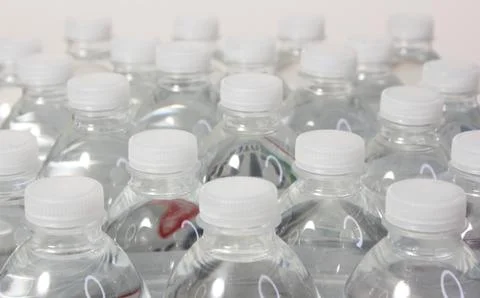 Case of Filtered Drinking Water Close up on Caps Stock Photos
