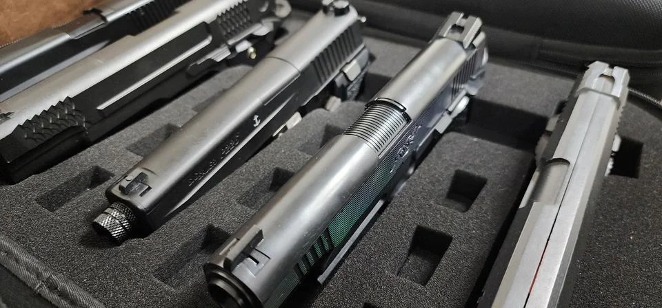 A case full of guns  Stock Photos