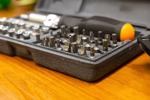 Case with interchangeable bits and nozzles of a manual screwdriver locksmith Stock Photos