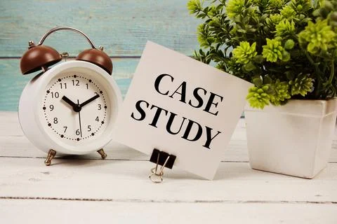 Case Study text written on paper card with alarm clock on wooden background Stock Photos