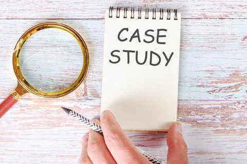 Case study written on a blank sheet of a notebook which is touched by a man.. Stock Photos