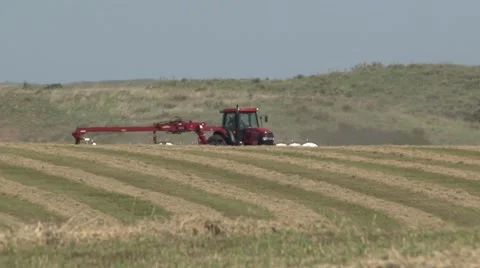 Case Tractor Raking Over Hill Far Shot Stock Footage 40462109