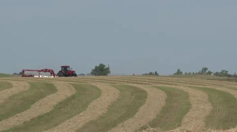 Case Tractor Raking Over Hill Stock Footage 40462666