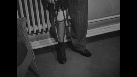 Cases of leg amputation, men showing how their artificial limbs work, 1944, UK Vidéo 130663340