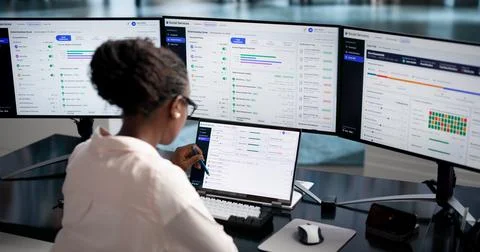 Caseworker Uses Laptop To Review Client Intake Details For Benefits. Stock Photos