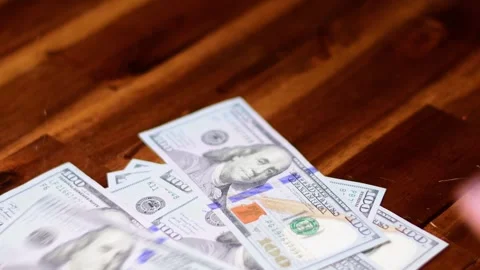 Cash 100$ bills on the table, counting money, savings Stock Footage 257939307