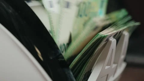 Cash counting machine displaying stacks of euro banknotes in a continuous flow, Stock Footage 331079618