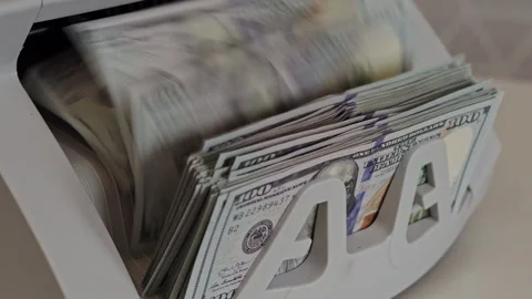 Cash counting machine processing new bills in a busy office environment Stock Footage 298890925