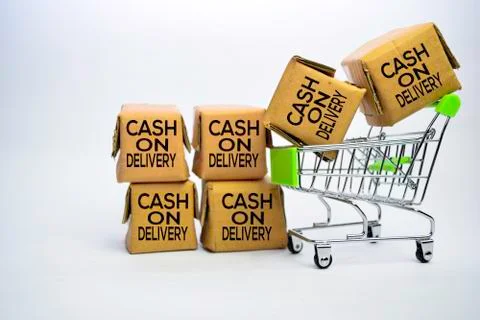 Cash On Delivery Text in small boxes and shopping cart. Stockfoto's