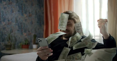 Cash flow, dollar bills floating in the man face. Online smartphone money rain 스톡 동영상 239953778