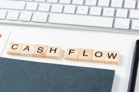 Cash flow statement concept with letters on cubes Stock Photos