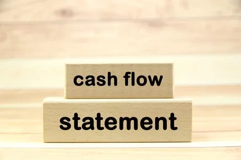 Cash flow statement wording  or text on wood block with wooden background.C.. Stock Photos