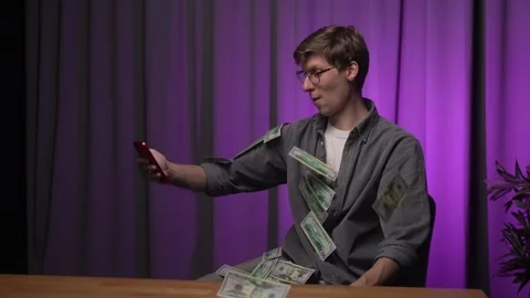 Cash fly, dollar floating in the man face. Online winning. Money rain Stock Footage 286019727