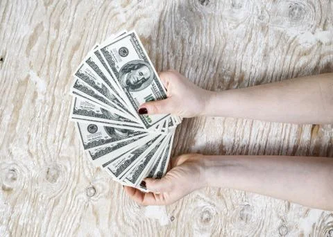 Cash in hands Stock Photos