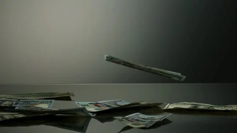 Cash money falling down on a gray table surface Stock Footage 326748628
