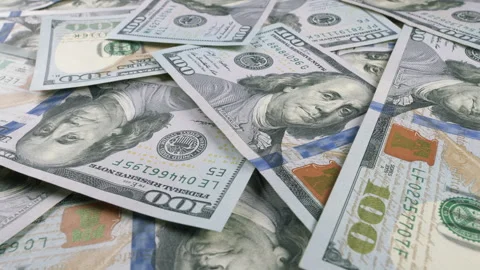 A Cash Pile Comprising U.S. Dollar Bills in a Variety of Different Denominations Stock Footage 303585099