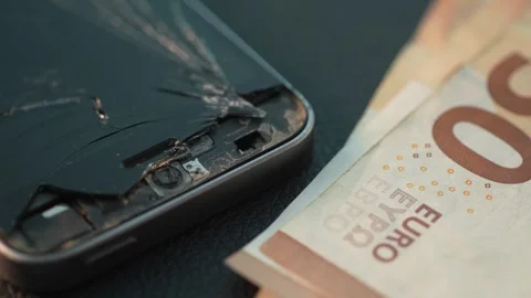 Cash Placed next to the Broken Phone. Stock Footage 267276924