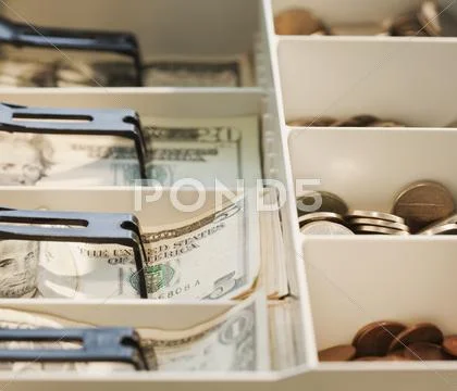 Cash register drawer full of money Stock-Fotos