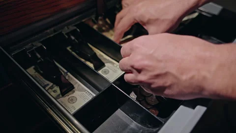 Cash register drawer opened during payment process, cashier hand placing Stock Footage 324865392