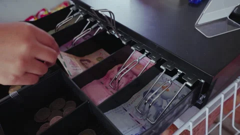 Cash register drawer opened during payment process in a retail store. Stock Footage 329612614