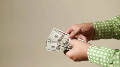 Cash transaction gives dollars Stock Footage 100535087