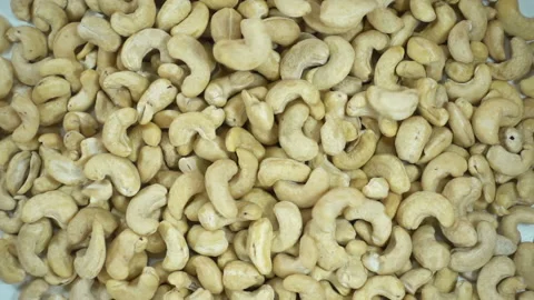 Cashew falling in slow motion on a pile of nuts Stock Footage 153255973