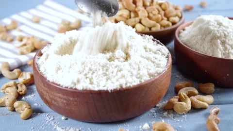 Cashew flour with whole nuts Video stock 169938156