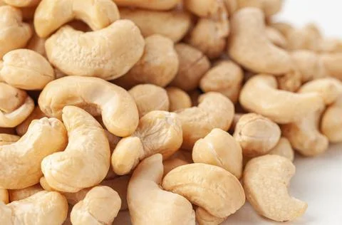 Cashew group. Close-up. White background . Isolated. Stock Photos