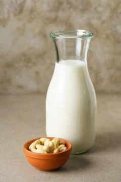 Cashew milk in a bottle Stock Photos