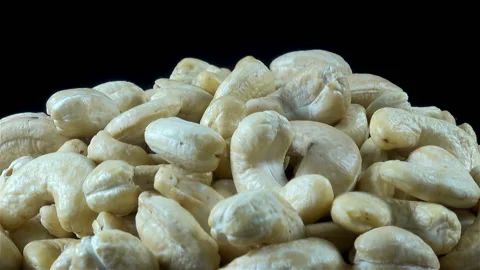 Cashew nuts on a black. Close-up Stock Footage 135758510