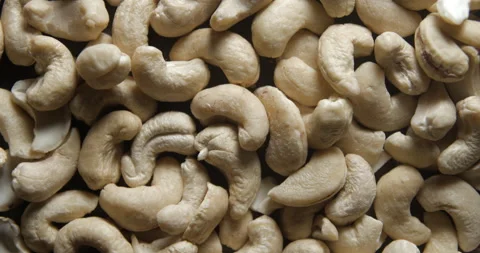 Cashew nuts close up studio shot over rotating Stockbeeldmateriaal 324838055