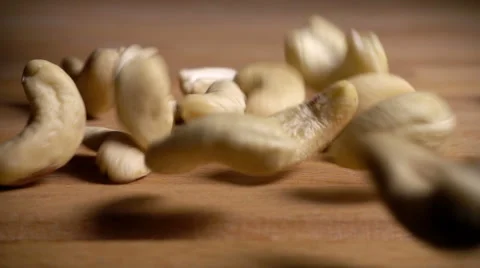Cashew nuts fall and bounce, slow motion Stock Footage 61690716