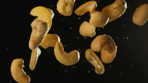 Cashew Nuts Falling with Black Background Slow Motion Stock Footage 159630603