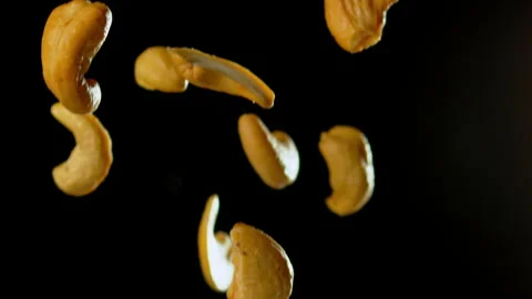 Cashew Nuts Falling with Black Background Slow Motion Stock Footage 159630810