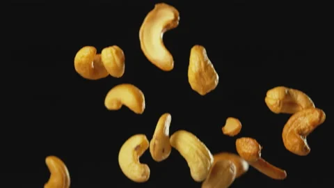 Cashew Nuts Falling with Black Background Slow Motion Stock Footage 159683948