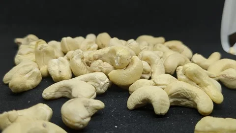 Cashew Nuts Falling Down in Black Background. Stock Footage 303747410