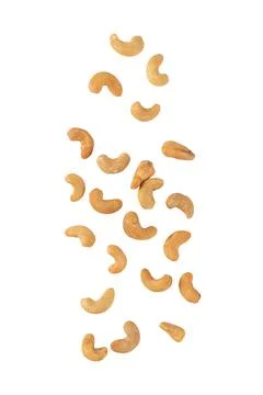 Cashew nuts falling isolated on white background with clipping path Stock Photos