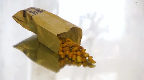 Cashew nuts lying on a mirror table, close-up Stock-Footage 67719381