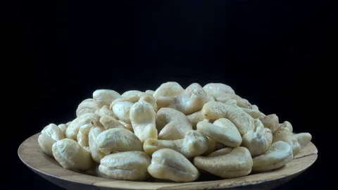 Cashew nuts on a plate in 4K Video stock 154744685